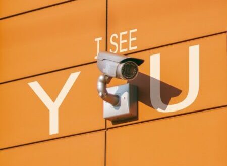 Photo by Alexey Sabulevskiy a security camera mounted to the side of a building